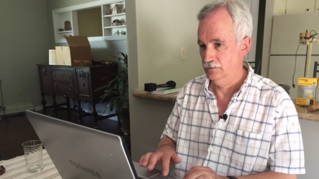 Steve Morshead typing on a laptop.